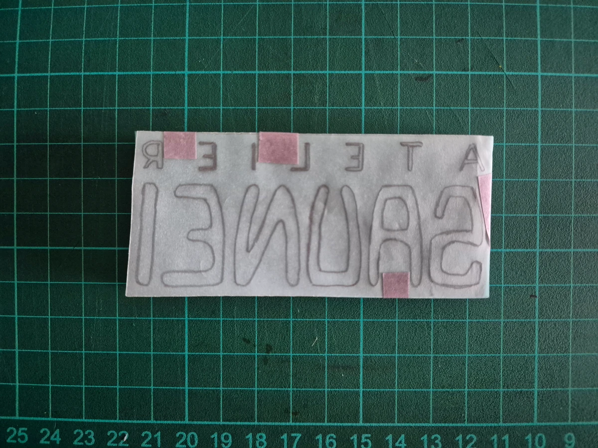 Tracing paper taped down so it doesn’t move during transfer